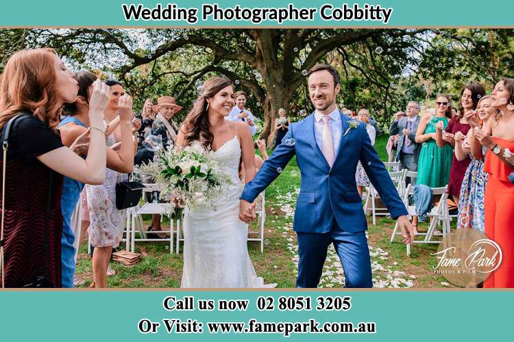 Photo of the Bride and the Groom showering bubbles by the visitors Cobbitty NSW 2570