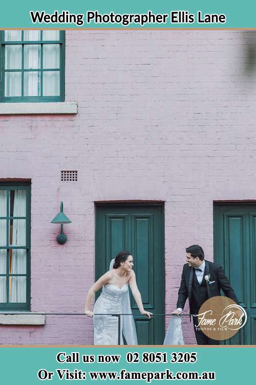 Photo of the Bride and the Groom looking each other at the balcony Ellis Lane NSW 2570