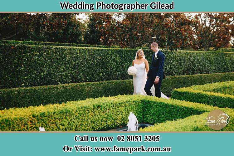 Photo of the Bride and the Groom walking at the garden Gilead NSW 2560