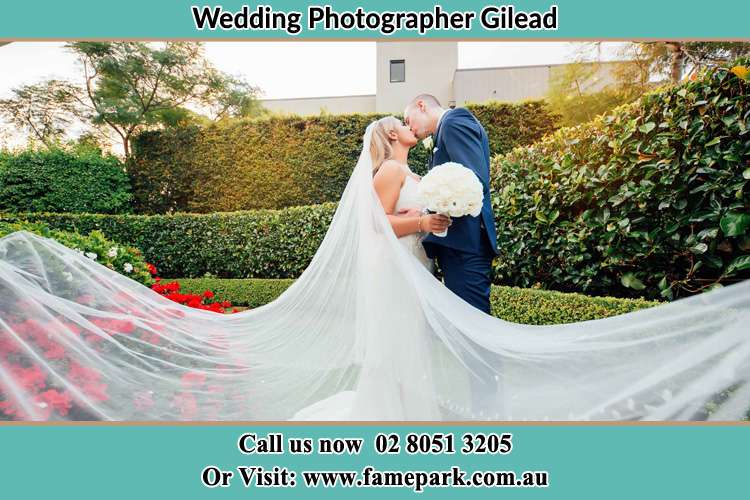 Photo of the Bride and the Groom kissing at the garden Gilead NSW 2560