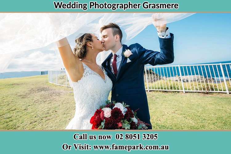 Photo of the Groom and the Bride kissing at the yard Grasmere NSW 2570