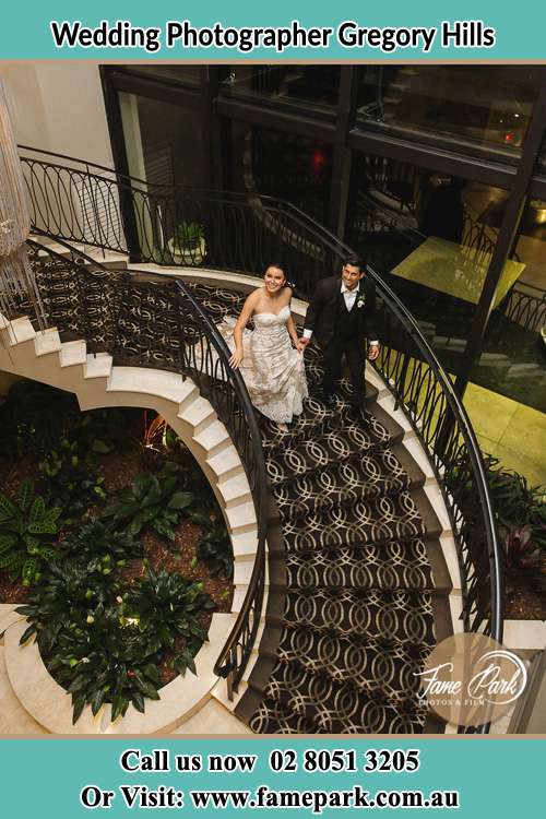 Photo of the Bride and the Groom going down the stair Gregory Hills NSW 2557