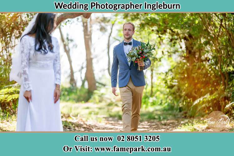 Photo of the Groom bringing flower to the Bride Ingleburn NSW 2565