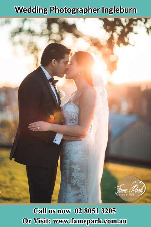 Photo of the Groom and the Bride kissing at the yard Ingleburn NSW 2565