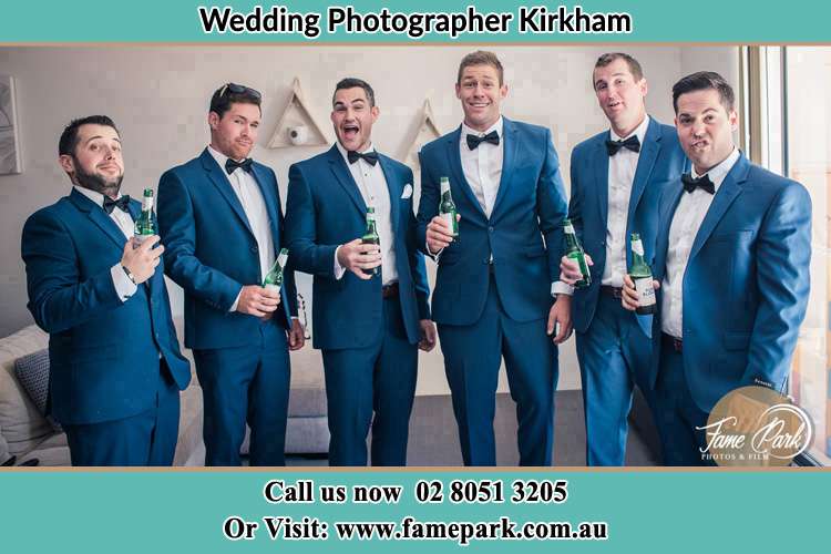 The groom and his groomsmen striking a wacky pose in front of the camera Kirkham NSW 2570