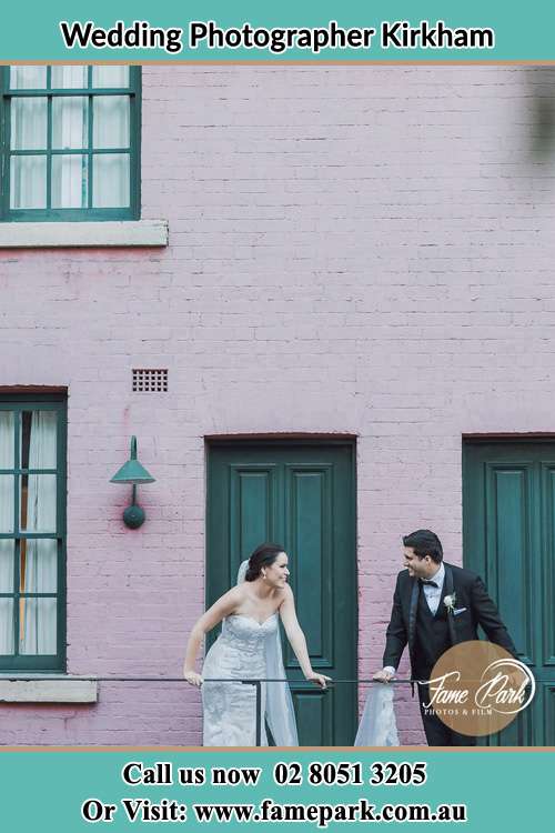 Photo of the Bride and the Groom looking each other at the balcony Kirkham NSW 2570