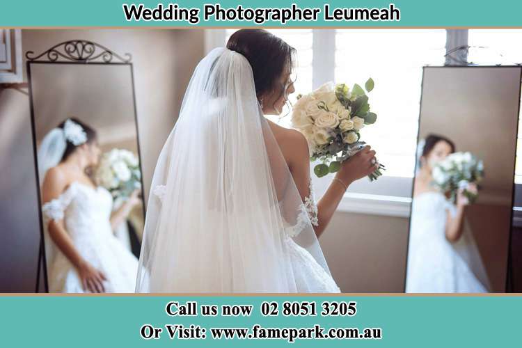 Photo of the Bride holding flower at the front of the mirrors Leumeah NSW 2560