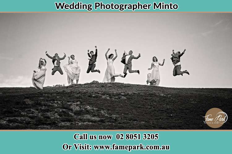 Jump shot photo of the Groom and the Bride with the entourage Minto NSW 2566