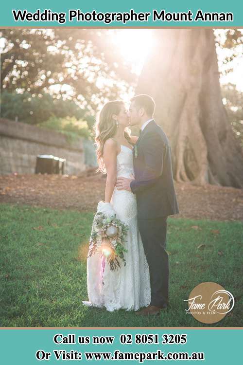 Photo of the Bride and the Groom kissing at the yard Mount Annan NSW 2567