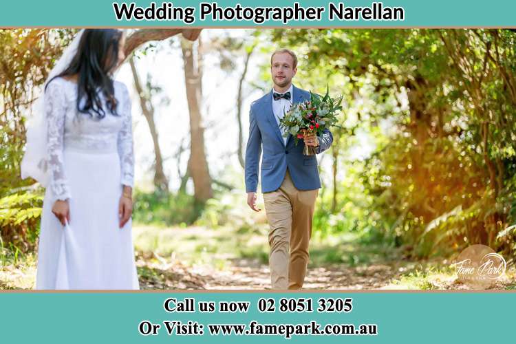 Photo of the Groom bringing flower to the Bride Narellan NSW 2567