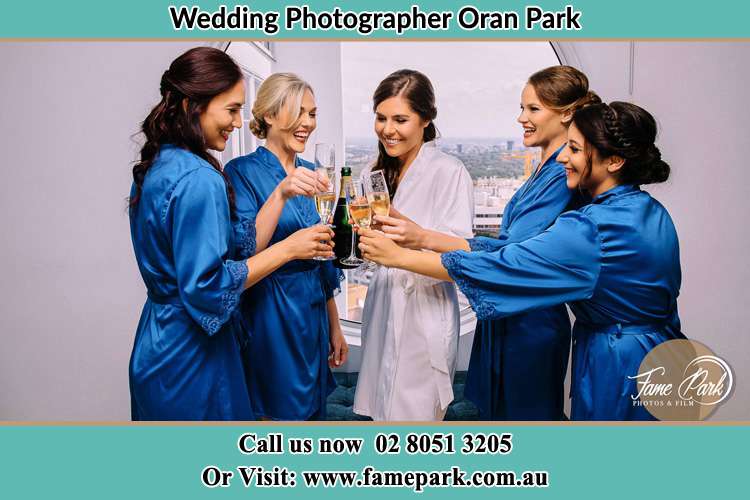 Photo of the Bride and the bridesmaids drinking wine Oran Park NSW 2570