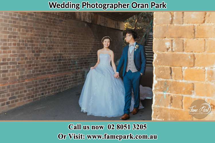 Photo of the Bride and the Groom walking Oran Park NSW 2570