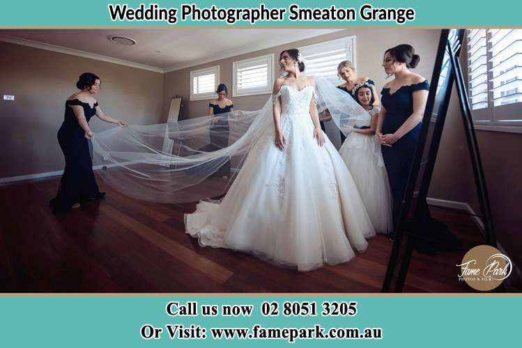 Photo of the Bride and the secondary sponsor preparing Smeaton Grange NSW 2567