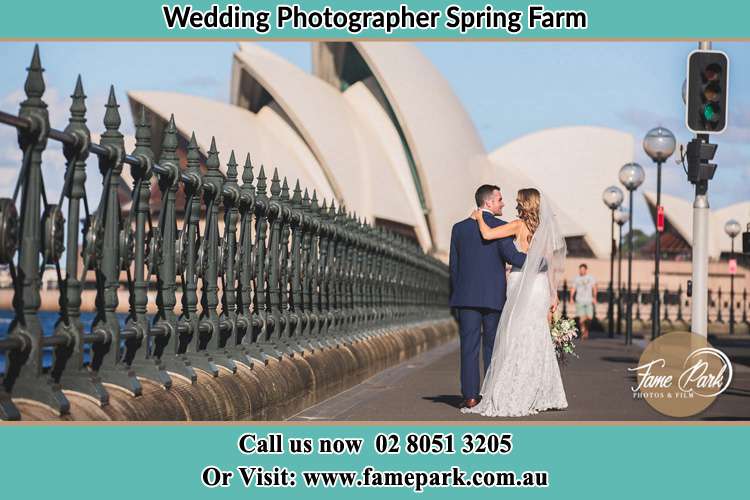 The Groom and the Bride walking towards the Sydney Grand Opera House Spring Farm NSW 2570