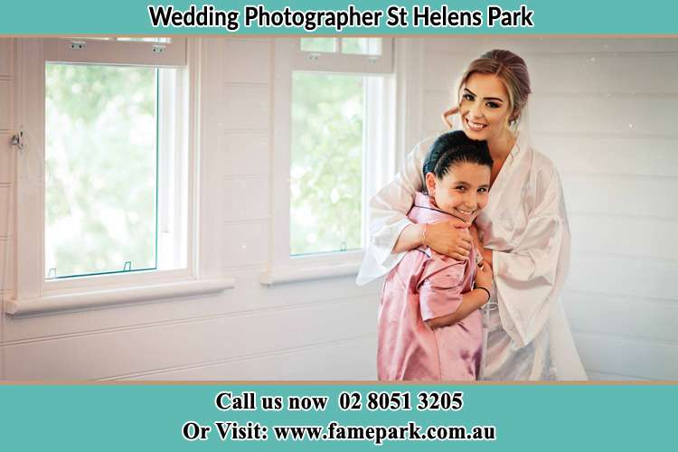 Photo of the Bride hugging the flower girl St Helens Park NSW 2560